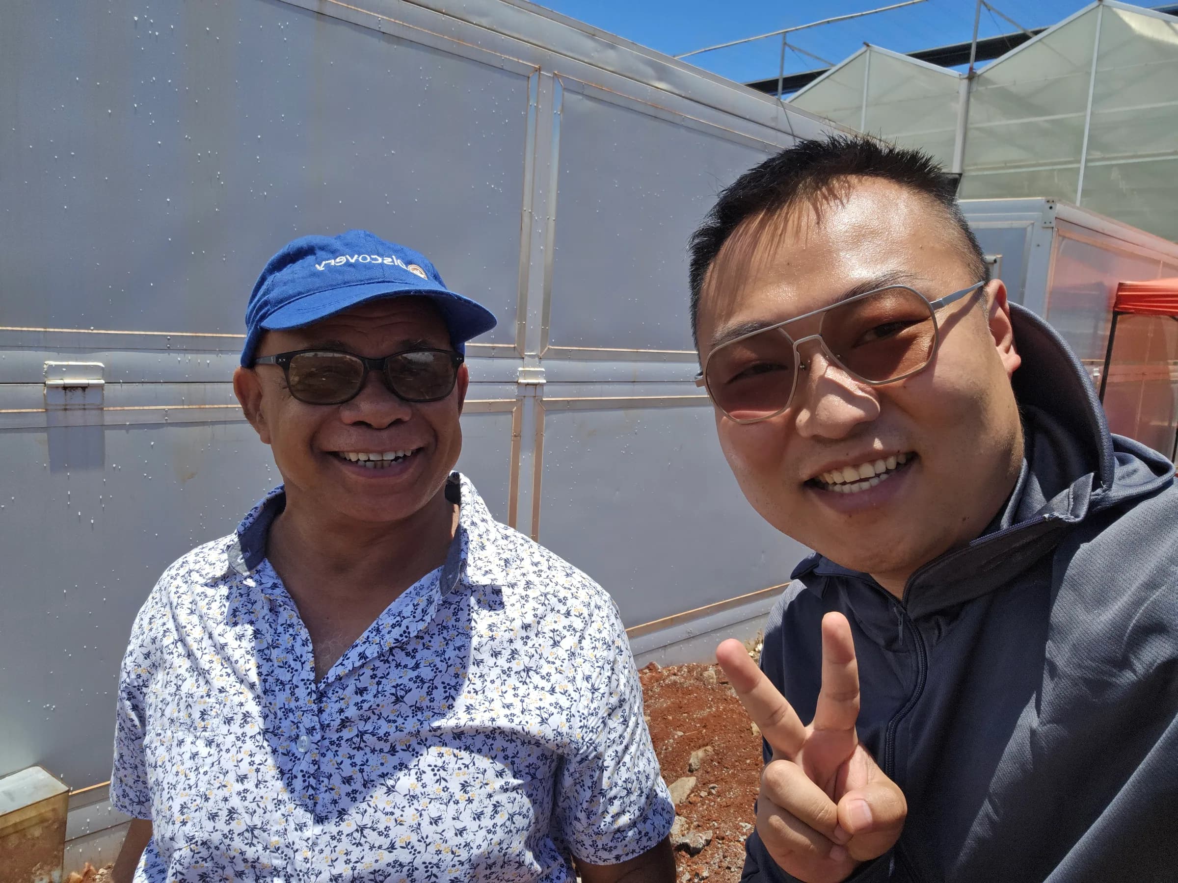Rongkai Solar representative with an overseas partner at a solar project site.