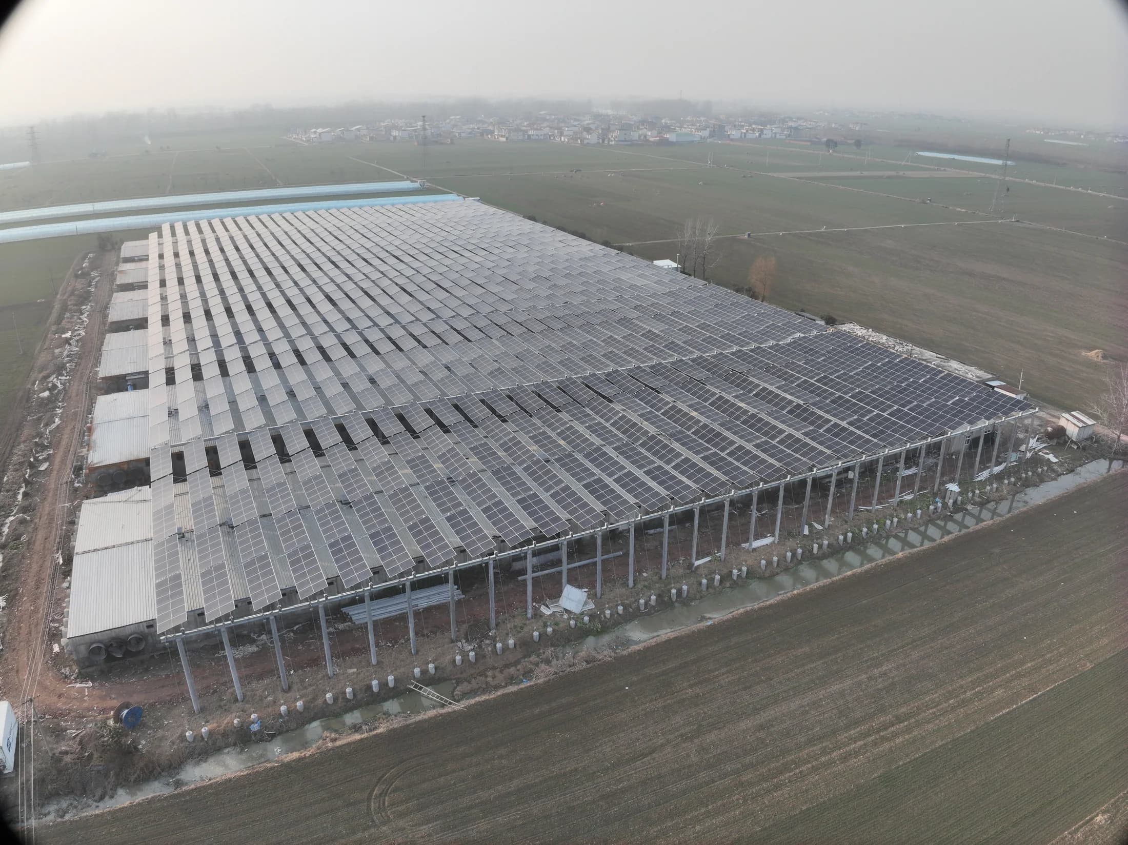 Rongkai Solar installation view focused on solar modules, cabinets, and team collaboration.