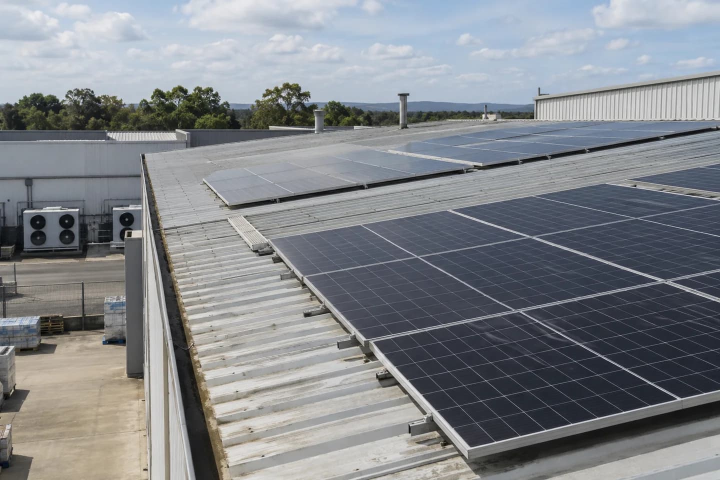 Editorial illustration of solar panels on an industrial roof