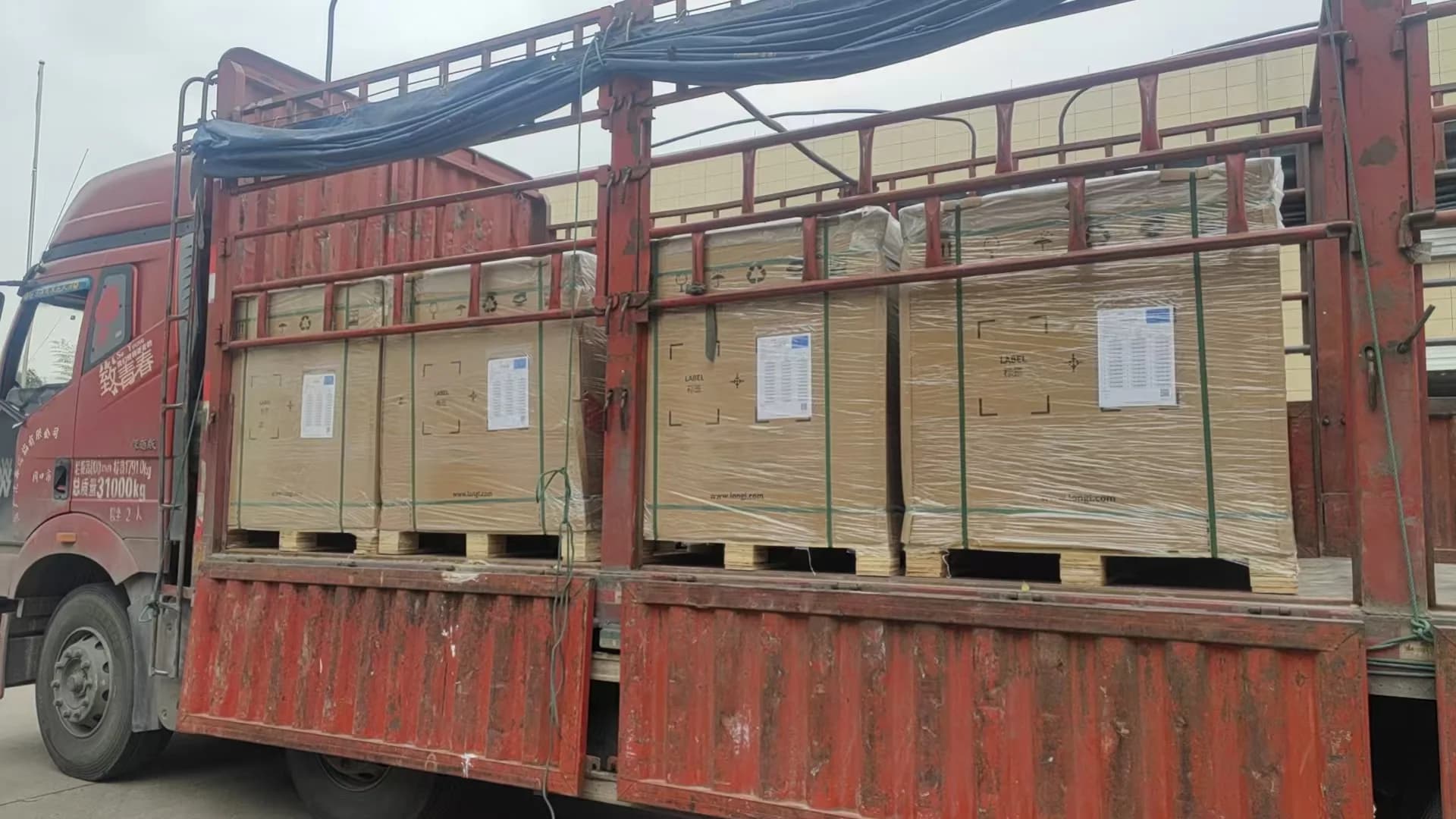 Rongkai Solar: Palletized solar modules prepared for loading.